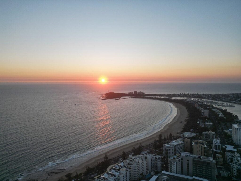 Sunrise over Mooloolaba beach and Point Cartwright with the Mooloolah River marina