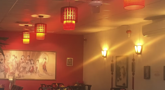 Red pendant lights, wall lamps and framed artwork in Buderim restaurant for sale